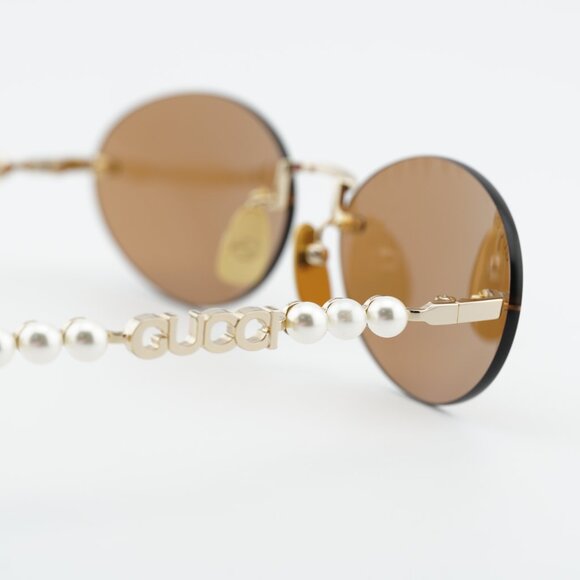 Gucci GG1922S 003 Sunglasses Endura Gold with Pearl Oval  display picture 3